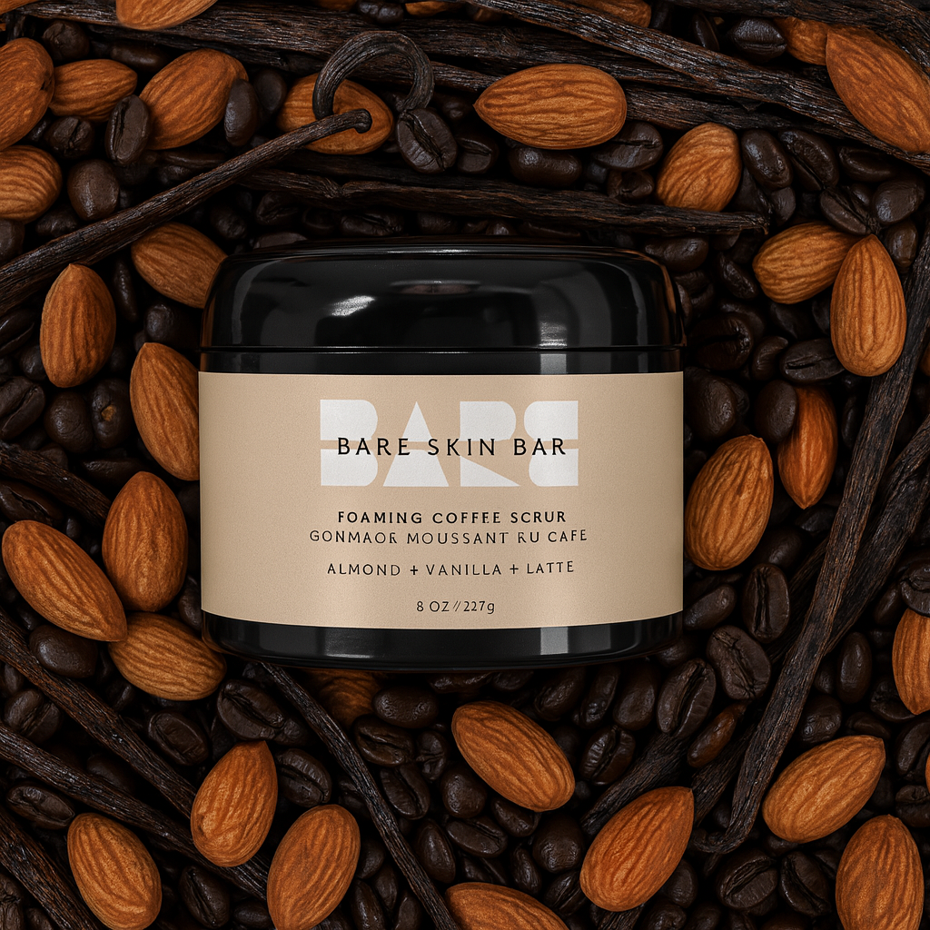 bare skin coffee scrub surrounded by coffee beans and almonds
